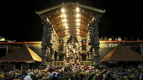 Devotees with 'irumudi', a bag carried on head during pilgrimage to Sabarimala temple