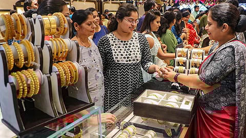 Representative Image for people viewing gold jewellery at a shop 