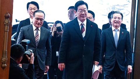 South Korean President Lee Jae Myung, center, arrives at the presidential office Cheong Wa Dae, or the Blue House in Seoul (AP)