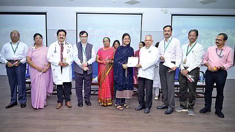 A PG student receiving appointment letter during the induction ceremony held at SRM Medical College Hospital and Research