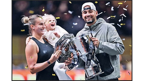 Aryna Sabalenka with her goddaughter Nicole and Nick Kyrgios celebrate with the titles