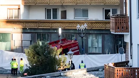 Police officers inspect the area where a fire broke out at the Le Constellation bar and lounge leaving people dead and injured, during New Year’s celebration, in Crans-Montana, Swiss Alps, Switzerland (AP)