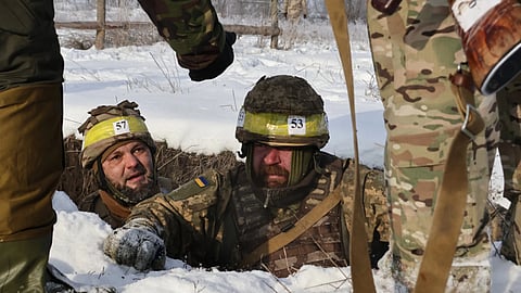 Recruits perform drills at a training ground in the Zaporizhzhia region, Ukraine