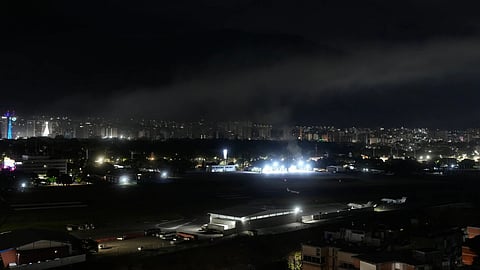 Smoke raises at La Carlota airport after explosions and low-flying aircraft were heard in Caracas, Venezuela