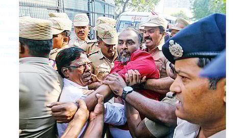 Police personnel on security evicting CPM cadre from the
protest venue near the US Consulate in Chennai on Monday