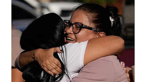 Relatives of detainee Yosnars Baduel embrace outside the Rodeo I prison in Guatire, Venezuela after National Assembly President Jorge Rodriguez said the government would release Venezuelan and foreign prisoners.
