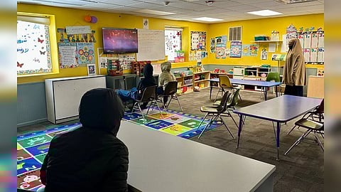 Children watching television at learning centre