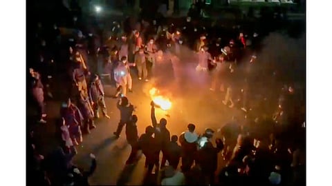 In this frame grab from footage circulating on social media shows protesters dancing and cheering around a bonfire as they take to the streets despite an intensifying crackdown as the Islamic Republic remains cut off from the rest of the world, in Tehran, Iran.
