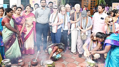District Collector celebrating Pongal with foreign visitors at Tiruchy on Tuesday