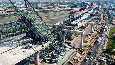  A construction crane that collapsed on the Rama 2 Road elevated expressway in Samut Sakhon province, Thailand on Thursday, Jan. 15, 2026.
