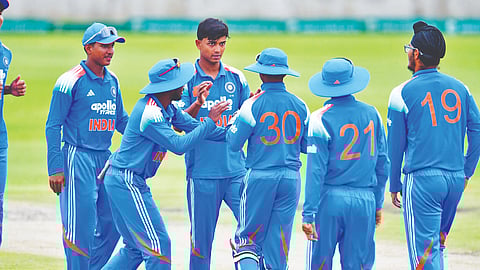 Indian players celebrate after a wicket in the warm-up series