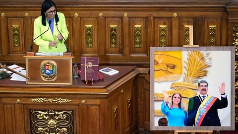 Venezuela's acting President Delcy Rodriguez addresses lawmakers next to a picture of former President Nicolas Maduro and his wife Cilia Flores, at the National Assembly in Caracas, Venezuela (Credit: AP)