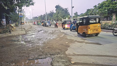 Wet and damaged Swami Sivananda Salai (left) linking the main road near MLA Hostel