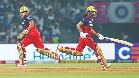Richa Ghosh (left) and Radha Yadav added 105 runs for the fifth wicket