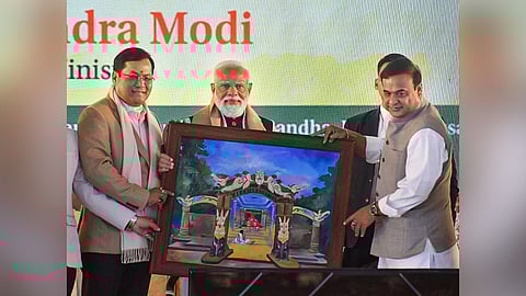 Prime Minister Narendra Modi with Union Minister Sarbananda Sonowal and Assam Chief Minister Himanta Biswa Sarma during the foundation stone laying ceremony for the Kaziranga Elevated Corridor, at Kaliabor, in Nagaon district, Assam, Sunday, Jan. 18, 2026. PM Modi also virtually flagged off two Amrit Bharat trains in Assam's Nagaon district. 