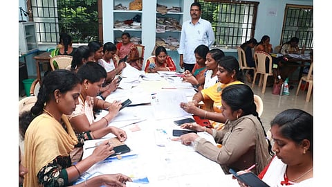 Illam Thedi Kalvi volunteers working on SIR forms