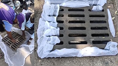 GCC worker fixing the net over a drain