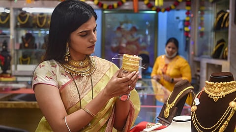 Image of a woman buying gold used for representative purposes