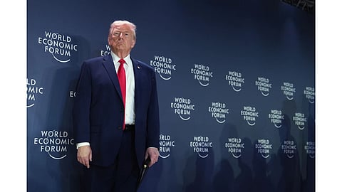 President Donald Trump stands on the stage prior to addressing a meeting of Global Business Leaders at the Annual Meeting of the World Economic Forum in Davos, Switzerland.