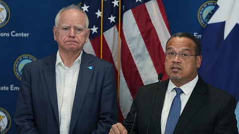 Attorney General Keith Ellison, (R), and Minnesota Gov. Tim Walz give a news conference in Blaine, Minn.