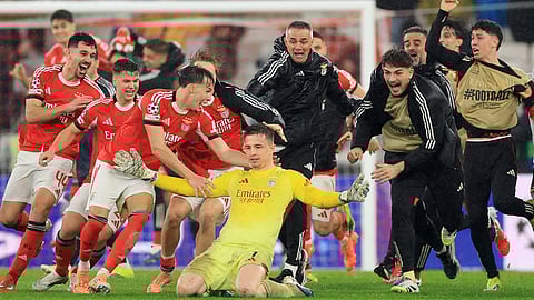 Benfica’s goalkeeper Anatoliy Trubin celebrates after scoring his team’s fourth goal against Real Madrid 
