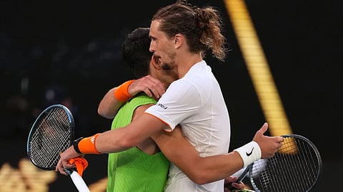Carlos Alcaraz of Spain is congratulated by Alexander Zverev, right, of Germany following their semifinal match at the Australian Open tennis championship in Melbourne in Australia.