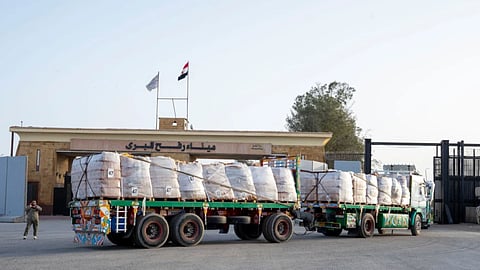 A truck enters the Egyptian gate of the Rafah crossing, heading for inspection by Israeli authorities before entering the Gaza Strip, Tuesday, Jan. 27, 2026.