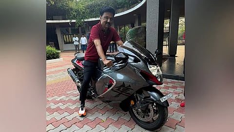 Tamil Nadu Chief Minister M K Stalin posing on a luxury superbike 