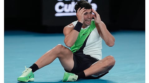 Carlos Alcaraz of Spain celebrates after defeating Novak Djokovic of Serbia in the men's singles final at the Australian Open tennis championship in Melbourne, Australia, Sunday, Feb. 1, 2026 