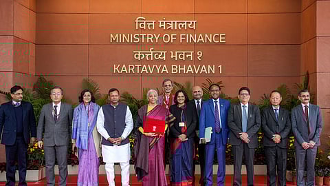 Finance Minister Nirmala Sitharaman with Minister of State for Finance Pankaj Chaudhary and her team members outside the Ministry of Finance before the presentation of the Union Budget 2026-27, in New Delhi, Sunday, Feb. 1, 2026.