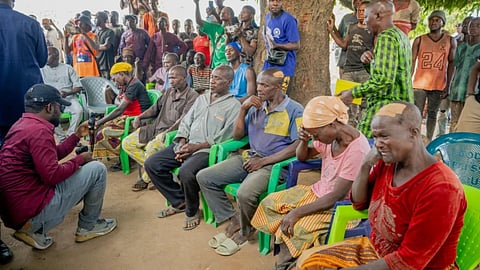 In this photo released by the Kaduna State government, people react during a meeting with Kaduna state Governor. Uba Sani, after gunmen attack in Kurmin Wali, northwest Nigeria, Wednesday, Jan. 21, 2026