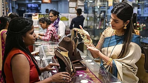 Image of a woman purchasing gold used for representative purpose