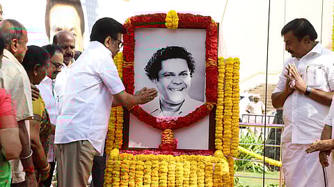 Chief Minister MK Stalin garlanding 'Kalaivanar' NS Krishnan's portrait at the hall named after the pioneering artiste on the sidelines of unveiling a crafts expo in Chennai on Thursday