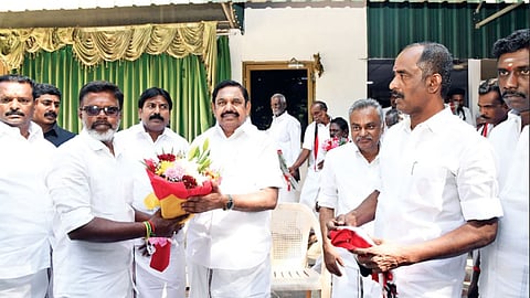 Supporters of O Panneerselvam greet AIADMK general secretary
Edappadi Palaniswami on joining the party in Chennai on February 5