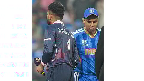 India's captain Suryakumar Yadav and USA's captain Monank Patel during the toss before the start of the ICC Men's T20 World Cup 2026 cricket match between India and USA, at the Wankhede Stadium, in Mumbai, Saturday, Feb. 7, 2026