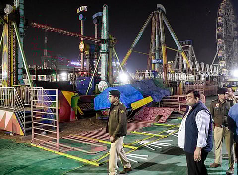 Police personnel at the spot after a swing fell down at Surajkund fair, in Faridabad, Saturday, Feb. 7, 2026. A police officer was killed and 13 other suffered injuries.