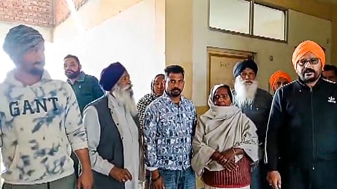 Family members of the victim gather at the institute after a female law student was shot dead by her classmate, in Tarn Taran district, Punjab, Monday, Feb. 9, 2026 