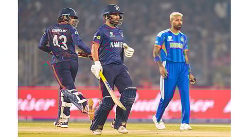 Namibia's Jan Frylinck, front right, and Louren Steenkamp run between the wickets during an ICC Men's T20 World Cup 2026 cricket match between India and Namibia, at the Arun Jaitley Stadium