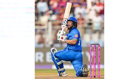 Italy's Justin Mosca plays a shot during the ICC Men's T20 World Cup 2026 cricket match between Italy and Nepal, at the Wankhede Stadium, in Mumbai, Maharashtra, Thursday, Feb. 12, 2026 