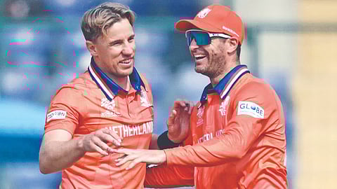 Netherlands' Logan van Beek (left) celebrates a wicket 