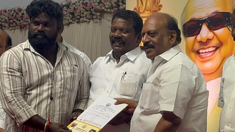 TNCC president K Selvaperunthagai with MS&ME Minister TM Anbarasan distributing house pattas to beneficiaries at a government event in Sriperumputhur 