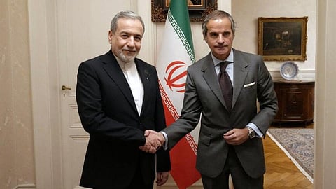 Iranian Foreign Minister Abbas Araghchi, left, shakes hands with International Atomic Energy Agency (IAEA) Director-General Rafael Grossi during their meeting in Geneva, Switzerland