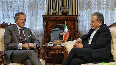 In this photo released by the Iranian Foreign Ministry, Iranian Foreign Minister Abbas Araghchi, right, and International Atomic Energy Agency (IAEA) Director-General Rafael Grossi, left, hold a meeting in Geneva, Switzerland, Monday, Feb. 16, 2026. 