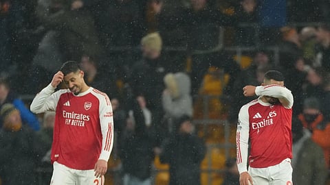 Arsenal's Gabriel Jesus and William Saliba react during the Premier League soccer match between Wolverhampton Wanderers and Arsenal in Wolverhampton.