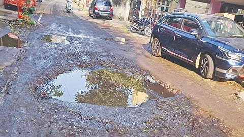 Sewage water-filled damaged Veerapandiya Kattabomman Road