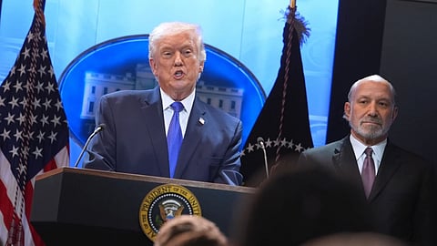 President Donald Trump speaks during a press briefing at the White House, Friday, Feb. 20, 2026, in Washington, as Commerce Secretary Howard Lutnik
