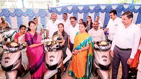DMK MP Kanimozhi handing over scooters to differently abled at a government event in Thoothukudi on February 22