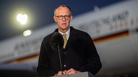 Germany’s Federal Chancellor Friedrich Merz (CDU) speaks during a press statement before his departure for China, in Brandenburg, Germany, Tuesday, Feb. 24, 2026.