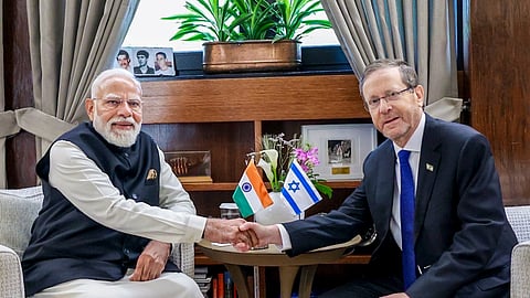 Prime Minister Narendra Modi with Israeli President Isaac Herzog during a tree plantation initiative, in Israel