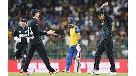 New Zealand's Rachin Ravindra, right, celebrates with teammates the wicket of Sri Lanka's captain Dasun Shanaka, centre, during the T20 World Cup cricket match between Sri Lanka and New Zealand in Colombo, Sri Lanka, Wednesday, Feb. 25, 2026. 